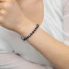 Złota bransoletka grafitowe kamienie holo i diamentowane kulki na czarnym sznurku Animo  B-GW-405-585 marko