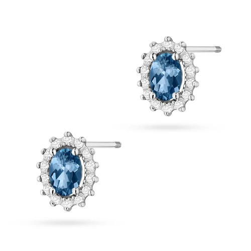 Klasyczne kolczyki z białego złota z topazem london blue i brylantami sztyft zakręcany labret