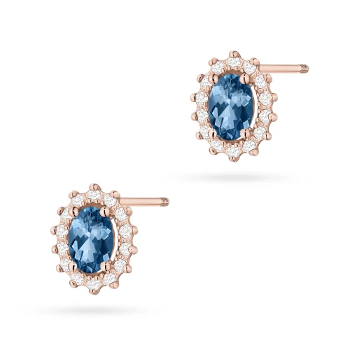 Klasyczne kolczyki z różowego złota z topazem london blue i brylantami sztyft zakręcany labret