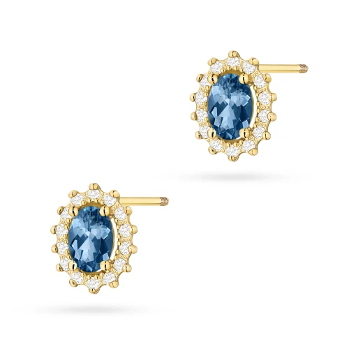 Klasyczne złote kolczyki z topazem london blue i brylantami sztyft zakręcany labret