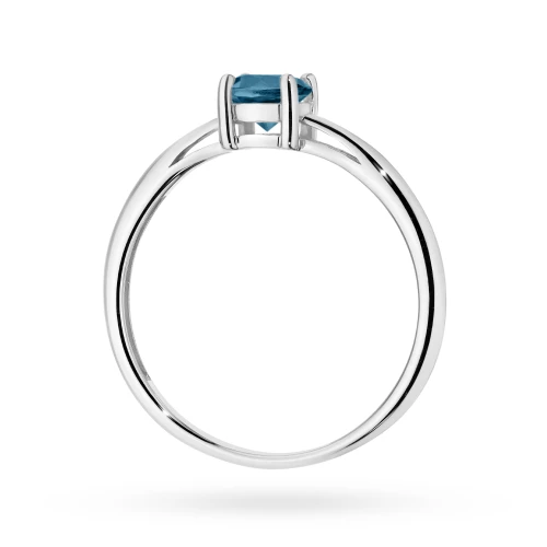 Złoty pierścionek z dużym topazem London  Blue 0,50ct z białego złota Kultowa