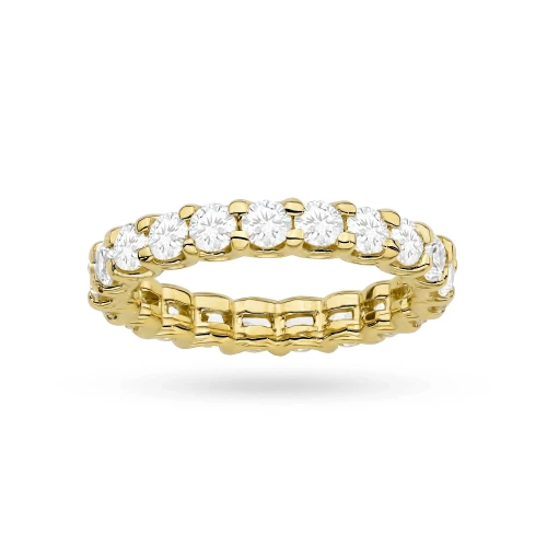 A detailed view of a yellow gold eternity ring set with brilliant-cut laboratory-grown diamonds all around the band, presented on a clean white background, product W0515.Z3.LDW.01