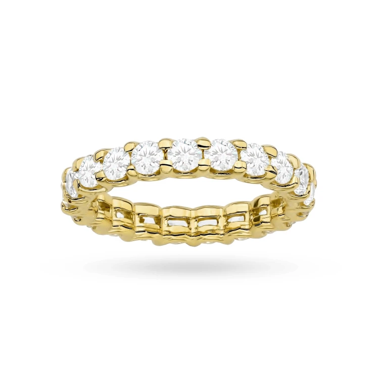 A detailed view of a yellow gold eternity ring set with brilliant-cut laboratory-grown diamonds all around the band, presented on a clean white background, product W0515.Z3.LDW.01