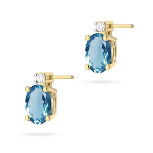 Kolczyki z żółtego złota z brylantami  i owalnym topazem London Blue sztyft zakręcany labret
