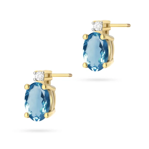 Kolczyki z żółtego złota z brylantami  i owalnym topazem London Blue sztyft zakręcany labret