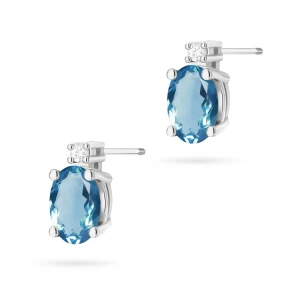 Kolczyki z białego złota z brylantami  i owalnym topazem London Blue sztyft zakręcany labret
