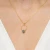 Srebrny pozłacany naszyjnik ring z czarną koniczynką Kleur N1131-925-CZZ marko