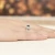 Białe złoto pierścionek zaręczynowy z topazem London Blue 0,50ct i brylantami Dynastia